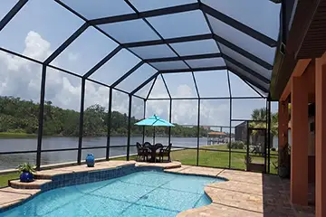Mansard pool enclosure by East Coast Aluminum